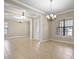 Spacious living room with tile floors and an abundance of natural light from multiple windows at 15708 Oakleaf Run Dr, Lithia, FL 33547