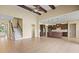 Expansive living space boasts an open floor plan, stairs, and a modern kitchen at 15708 Oakleaf Run Dr, Lithia, FL 33547
