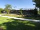 Exterior view of community tennis courts with fencing, landscaping and shade trees at 15708 Oakleaf Run Dr, Lithia, FL 33547