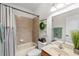 Traditional bathroom with a shower-tub combo, and decorative vanity mirror at 15912 Ternglade Dr, Lithia, FL 33547