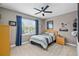 Cozy bedroom featuring a single bed, ceiling fan, and a window with natural light at 15912 Ternglade Dr, Lithia, FL 33547
