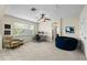 Bright, open bonus room with office setup, seating area, and neutral carpet at 15912 Ternglade Dr, Lithia, FL 33547
