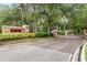 Paved entrance to Tern Wood community with gatehouse and lush Florida foliage at 15912 Ternglade Dr, Lithia, FL 33547