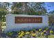 Aquatic Club sign surrounded by flowers and lush landscaping on a sunny day at 15912 Ternglade Dr, Lithia, FL 33547