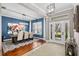Elegant dining room featuring a modern chandelier, large windows, and hardwood floors at 15912 Ternglade Dr, Lithia, FL 33547