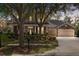 Beautiful two-story home with well-maintained landscaping and stone accents in the evening at 15912 Ternglade Dr, Lithia, FL 33547