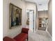 Upstairs hallway features artwork and leads to bedrooms at 15912 Ternglade Dr, Lithia, FL 33547