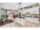Bright kitchen with granite countertops, a center island, and ample cabinet space perfect for cooking and entertaining at 15912 Ternglade Dr, Lithia, FL 33547