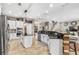 Bright, modern kitchen with granite countertops, stainless steel appliances, a breakfast bar and abundant cabinet space at 15912 Ternglade Dr, Lithia, FL 33547
