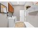 Functional laundry room with cabinets, shelving and washer and dryer at 15912 Ternglade Dr, Lithia, FL 33547