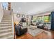 Cozy living room showcasing a comfortable seating arrangement, warm lighting, and a clear view to the lanai at 15912 Ternglade Dr, Lithia, FL 33547