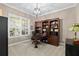 Cozy home office with custom built-ins, ample natural light, and neutral carpet at 15912 Ternglade Dr, Lithia, FL 33547