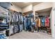Well-organized walk-in closet with ample shelving and hanging space for clothing and accessories at 15912 Ternglade Dr, Lithia, FL 33547