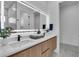 Elegant bathroom featuring a double vanity, illuminated mirror, and modern fixtures, creating a spa-like atmosphere at 1627 9Th N Ave, St Petersburg, FL 33713