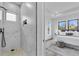 Modern bathroom featuring a glass shower, recessed niche, and an attached bedroom at 1627 9Th N Ave, St Petersburg, FL 33713