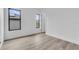 Bright bedroom featuring modern trim, light wood flooring, and sunlit windows at 1627 9Th N Ave, St Petersburg, FL 33713