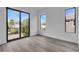 Well-lit room with large windows, wood floors, and white trim at 1627 9Th N Ave, St Petersburg, FL 33713