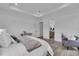 Bright bedroom with tray ceilings, wood floors, and an attached bath with modern decor at 1627 9Th N Ave, St Petersburg, FL 33713