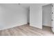 A bright, empty bedroom with a modern feel, light wood flooring, and freshly painted walls at 1627 9Th N Ave, St Petersburg, FL 33713