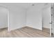 A bright, empty bedroom with a modern feel, light wood flooring, and freshly painted walls at 1627 9Th N Ave, St Petersburg, FL 33713