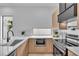 Modern kitchen featuring stainless steel appliances, custom cabinetry, and stylish countertops with natural light at 1627 9Th N Ave, St Petersburg, FL 33713