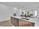 Open-concept kitchen with stainless steel appliances and a clear sight-line into the living area at 1627 9Th N Ave, St Petersburg, FL 33713