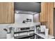 Modern kitchen with stainless steel appliances, custom cabinetry, and stylish countertops with marble backsplash at 1627 9Th N Ave, St Petersburg, FL 33713