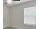 An empty bedroom with neutral walls, carpet, and blinds at 17014 Oval Rum Dr, Wimauma, FL 33598