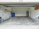 Spacious two-car garage with shelving and included utilities at 17014 Oval Rum Dr, Wimauma, FL 33598