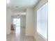 Bright living room featuring tile floors and large windows offering ample natural light at 17014 Oval Rum Dr, Wimauma, FL 33598