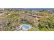 Scenic aerial view highlighting a community pool and surrounding lush trees at 1844 Bough Ave # C, Clearwater, FL 33760