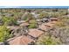 Aerial view of community with mature trees, manicured lawns, sidewalks, and a community pool at 1844 Bough Ave # C, Clearwater, FL 33760