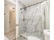 This bathroom features a walk-in shower with marble tiles and modern fixtures at 1844 Bough Ave # C, Clearwater, FL 33760