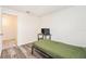 Bright bedroom featuring hardwood floors, a workstation, and a large closet offers a versatile space at 1844 Bough Ave # C, Clearwater, FL 33760