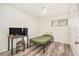 Bright bedroom featuring hardwood floors, a workstation, and a large closet offers a versatile space at 1844 Bough Ave # C, Clearwater, FL 33760