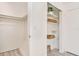 Brightly lit closet with storage shelves and a hanging rod for clothes and accessories at 1844 Bough Ave # C, Clearwater, FL 33760