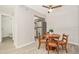 Cozy dining area with wood-look flooring and views of the adjacent kitchen and half bathroom at 1844 Bough Ave # C, Clearwater, FL 33760