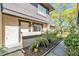 Inviting condo entrance featuring a landscaped garden with lush plants and a well-maintained walkway at 1844 Bough Ave # C, Clearwater, FL 33760