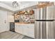 Charming kitchen featuring butcher block counters, subway tile backsplash, and stainless steel refrigerator at 1844 Bough Ave # C, Clearwater, FL 33760