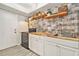 Well-appointed kitchen with butcher block counters, subway tile backsplash, and stainless steel appliances at 1844 Bough Ave # C, Clearwater, FL 33760