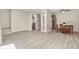 Open living space boasts wood-look tile floors and a flexible layout that flows into the kitchen at 1844 Bough Ave # C, Clearwater, FL 33760