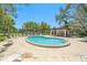 Community kidney-shaped pool with a shaded seating area and a view of the complex at 1844 Bough Ave # C, Clearwater, FL 33760