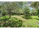 Spacious backyard with a mature tree canopy provides a private outdoor space at 18806 Autumn Lake Blvd, Hudson, FL 34667