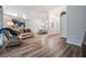 Open-concept living and dining area with lots of natural light, wood floors, and a cozy atmosphere at 18806 Autumn Lake Blvd, Hudson, FL 34667