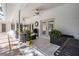 Covered outdoor patio features tile flooring, ceiling fans, and comfortable seating area at 18806 Autumn Lake Blvd, Hudson, FL 34667