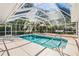Beautiful screened-in pool with comfortable patio furniture at 18806 Autumn Lake Blvd, Hudson, FL 34667