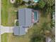 Aerial view of a home featuring a screened-in pool and spacious backyard at 20191 Rutherford Ave, Port Charlotte, FL 33952