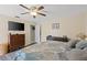 Spacious bedroom with wood flooring, ceiling fan and natural light at 20191 Rutherford Ave, Port Charlotte, FL 33952
