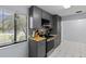 Bright kitchen offers stainless steel appliances, gray cabinets, and butcher block countertops at 20191 Rutherford Ave, Port Charlotte, FL 33952