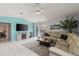 Relax in the living room with tile floors, and easy access to outdoor living and pool at 20191 Rutherford Ave, Port Charlotte, FL 33952